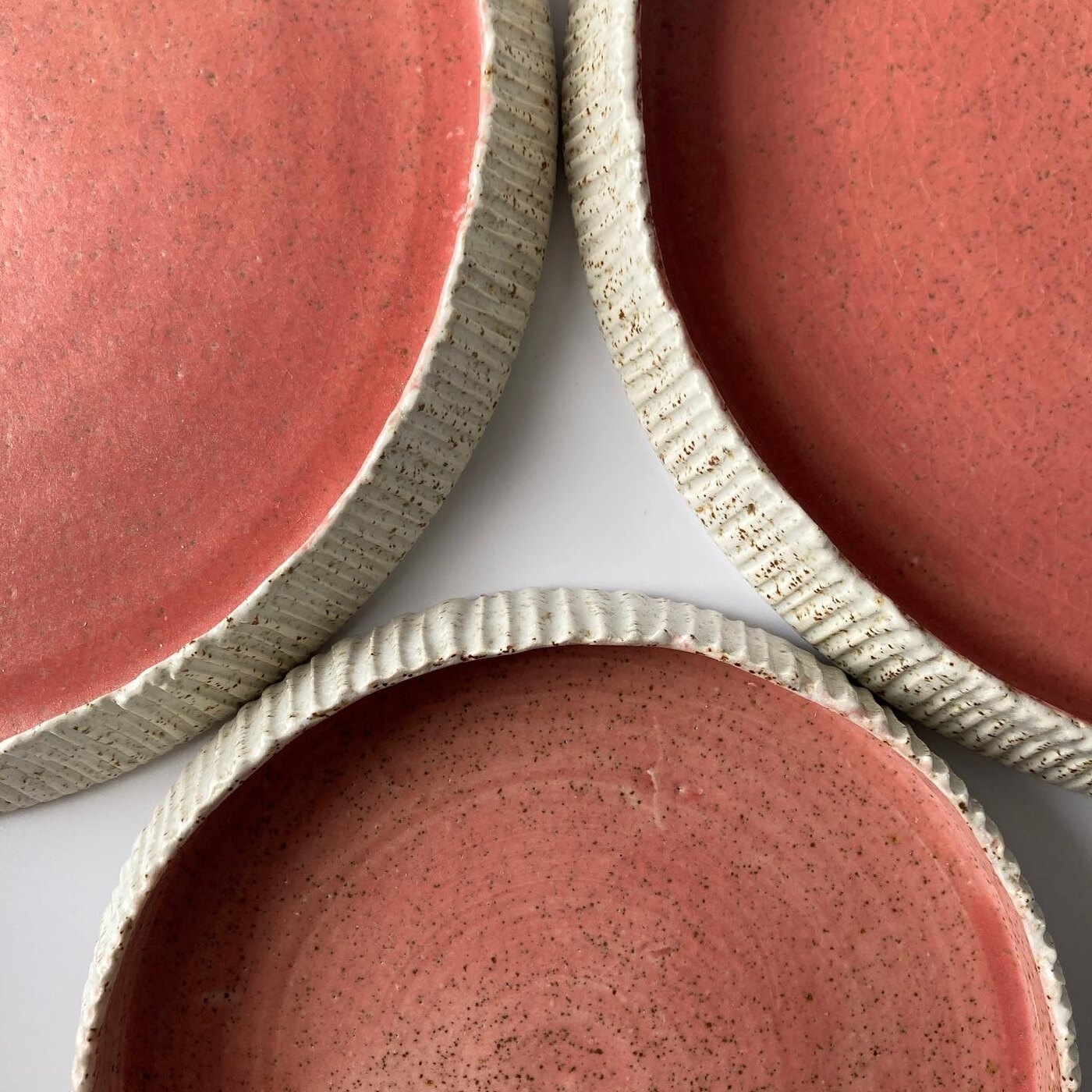 Barnacle plates in coral glaze with combed rims